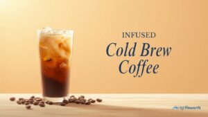 Glass of infused cold brew coffee with cream on a wood surface, warm golden background with INFUSED Cold Brew Coffee text