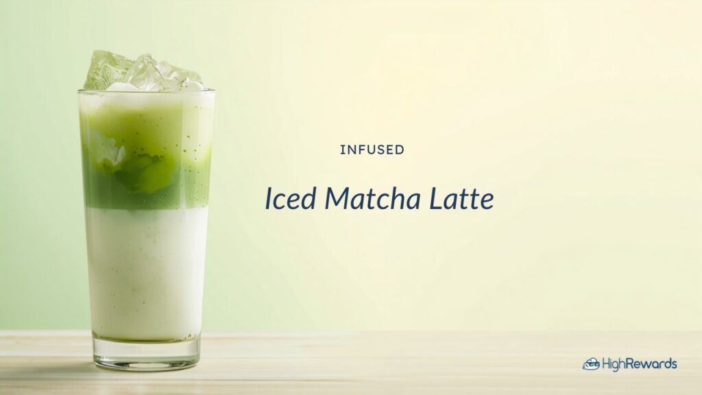 Tall glass of infused iced matcha latte with layered green matcha and milk