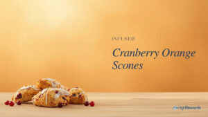 Infused cranberry orange scones with glaze on a wooden board